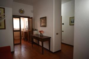 a room with a table with flowers on it at Via Belvedere 50 in Montefalco