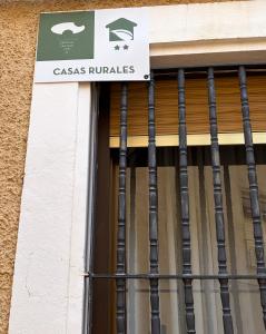 a sign on a window of a casas francolis at Casa Fuenteblanca in Liétor