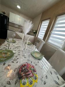 a dining room table with a plate of food on it at Christian Dior Lazarevac in Lazarevac