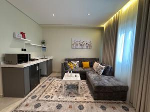 a living room with a couch and a table at Ambra 213 in Medina