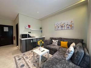 a living room with a couch and a table at Ambra 213 in Medina