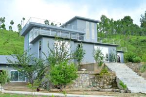a house on the side of a hill at Abbott royale farm in Abbottabad