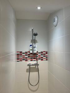 a bathroom with a shower with a shower head at L'Escapade Bourguignonne, à 10 minutes de Cluny, petit déjeuner inclus! in Clermain +27 photos