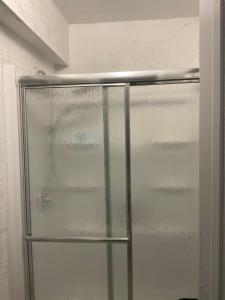 a glass door of a refrigerator in a room at Sweet Escape Cozy Studio in Fort Lauderdale +8 photos