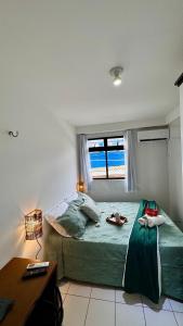 a bedroom with a bed and a desk and a window at (103) Coastal seaside - Pebble in Pimenta +60 photos