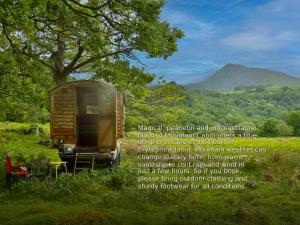 a poster of a tiny house in a field at 4x4 Mountain Cabin in Capel Curig