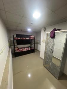 an empty room with a room with a shelf of food at BEYOND INFINITY GROUP, pg in Navi Mumbai