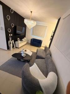a living room with a couch and a table at Oasis in San Isidro