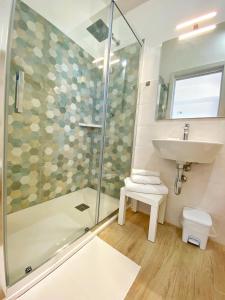 a bathroom with a shower and a sink at Campus Dei - Tropea Rooms in Tropea