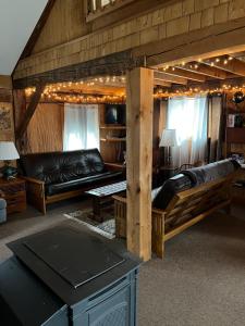a living room with a couch and a table at The Greenfield Inn in Greenfield
