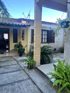 a house with a windmill on top of it at Suíte aconchego in Cabo Frio