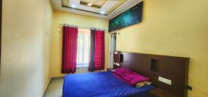 a bedroom with a bed with a purple blanket on it at Roca vista villaas vagamon in Vagamon