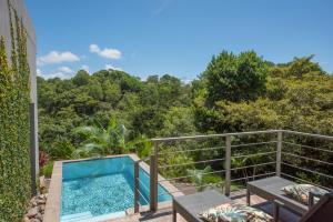 a plunge pool on the balcony of a villa at Villa Los Laureles III, Private Pool, Nature Trails, Beaches in Esterillos Este