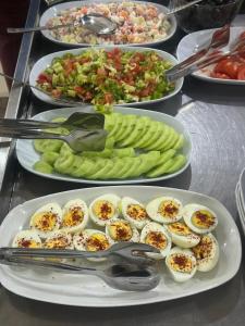 a buffet of food with eggs and vegetables on plates at Liora Old City in Istanbul