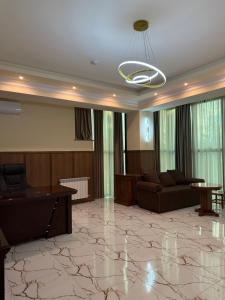 a living room with a couch and a table at Lalaner Hotel in Sisian