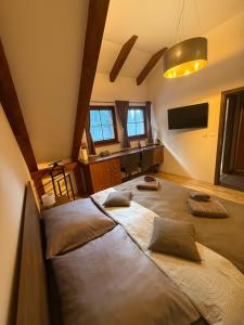 a bedroom with two beds in a room at Jezírko lesní restaurant & penzion in Jáchymov