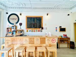 a coffee shop with a chalkboard on the wall at Porto Wine Hostel in Porto