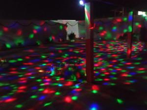 a group of lights on the ground at night at Hostel Mamitchesca in Canoa Quebrada