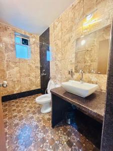 a bathroom with a sink and a toilet at Marshmallow - by MA Homes in Morjim +20 photos