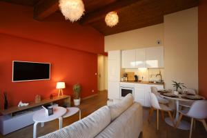 a living room with a couch and a table at Appartement le cocon de terre in Ambérieu-en-Bugey