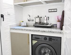 a laundry room with a washer and dryer at Tangier city center 1 in Tangier