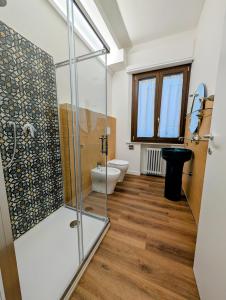 a bathroom with a shower and a toilet at Chianciano Lettings -Room and Apartments- in Chianciano Terme +61 photos