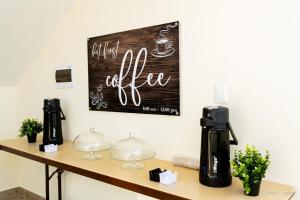 a coffee shop with a sign on the wall at Stars Hotel Bavaro in Punta Cana