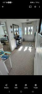 a view of a living room with the door open at Beach House Overlooking Lake Michigan in Algoma +11 photos