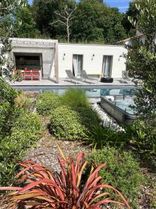 a house with a swimming pool in a yard at Small house with swimming pool and jacuzzi in Biarritz