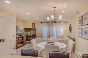 a dining room and living room with a table and chairs at Beach-N-Ski Condo in Tahoe Vista