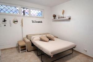 a hospital bed in a room with a window at Il Borghetto in Ciampino