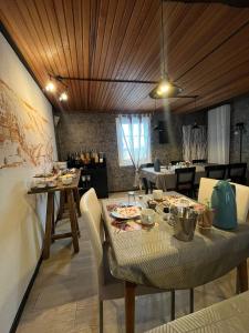 a dining room with a table with food on it at City B&B Cochem in Cochem