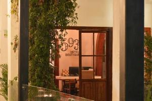 an open door to an office with a desk with a computer at 593 Hotel Boutique Baños in Baños