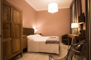 Postel nebo postele na pokoji v ubytování Palazzo Dei Mercanti - Dimora & Spa