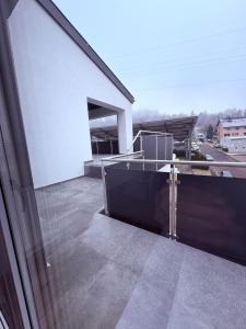 a balcony with a view of a building at Gästehaus GAP in Dietlingen