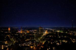 a view of a city at night at Themenpartment Starcruiser in Gelsenkirchen
