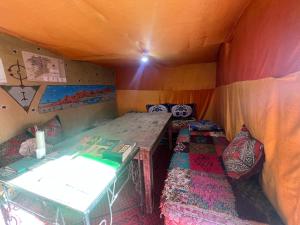 a small room with a bed and a table in it at Traditional nomad camp in Merdani