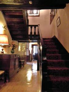 a staircase in a building with a stair case at Le Relais Cicero in La Flèche