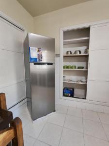 a large stainless steel refrigerator in a kitchen at York Hostel in La Paz +33 photos