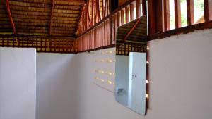 a room with two white walls and a window at Andaman Sunflower in Ko Lanta