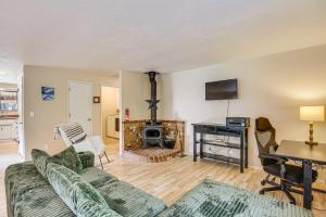a living room with a couch and a fireplace at Creative Escape! Eagle's Nest Hideaway in Cottage Grove