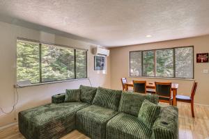 a living room with a couch and a table at Creative Escape! Eagle's Nest Hideaway in Cottage Grove