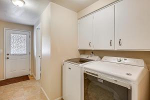 a kitchen with white cabinets and a white dishwasher at Creative Escape! Eagle's Nest Hideaway in Cottage Grove +22 photos