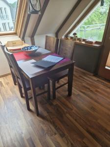 a dining room table with a bowl on top of it at Monteurs Wohnung in Andervenne in Andervenne Oberdorf +8 photos