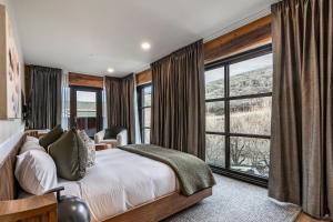 a bedroom with a bed and a large window at Main & SKY Park City Utah in Park City +62 photos