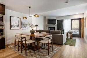 a living room with a table and a couch at Main & SKY Park City Utah in Park City