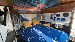a bedroom with a bed in a camper van at Hidden gem in Invernisk