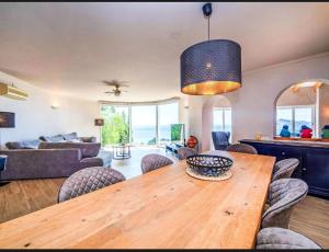 a living room with a wooden table and chairs at Altea Hills Best Seaview in Altea