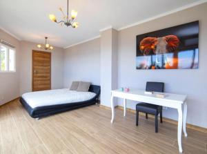 a bedroom with a bed and a desk and a table at Altea Hills Best Seaview in Altea +38 photos