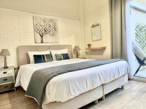 a bedroom with a large bed and a window at Luxury house near by Delphi in Kírra